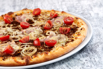fresh pizza on the white plate