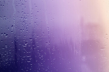 Raindrops on a clean window with abstract water patterns and droplets