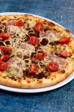 fresh pizza on the white plate