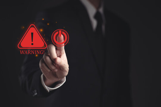 Warning hacked alert, cyberattack on computer network. Programmer, Businessman staff, developer using technology with triangle caution warning sign notification error and maintenance concept.