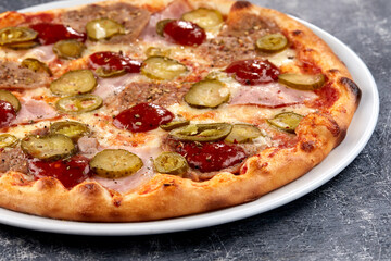 fresh pizza on the white plate