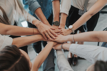 Obraz premium Teamwork concept with diverse hands joining together, symbolizing unity, cooperation, and collaboration 