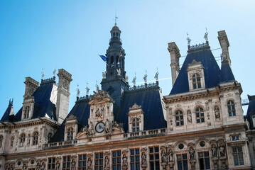 Famous building in the center of Paris the capital of France, City Hall with sculptures on the roof. Photography of architecture in Europe.