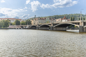 Naklejka premium View of Lesser Town and Petrin hill over the Vltava river near the Jiraskuv bridge in Prague.