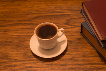 cup coffee books  in wooden background