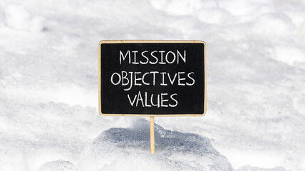 Mission objectives values symbol. Concept words Mission Objectives Values on beautiful black yellow...