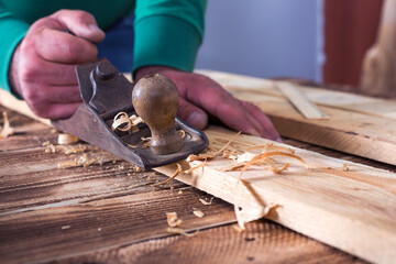 The carpenters are using spokeshave to decorate the woodwork.