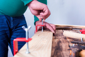 The carpenters are using spokeshave to decorate the woodwork.