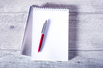 black pen and notebook in the white background