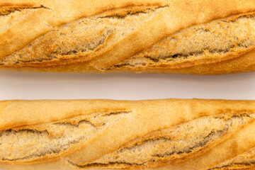 French baguette on a white background. macro shot of fresh bread, organic baked goods