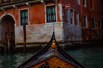 Venetian Serenity: A serene journey along a historic waterway in a traditional gondola, offering a...