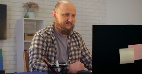Fototapeta premium Bald man sighs heavily as pressure mounts from endless deadlines, fueling pressure that saps focus, where pressure threatens productivity unless healthy coping steps emerge. Drinks coffee