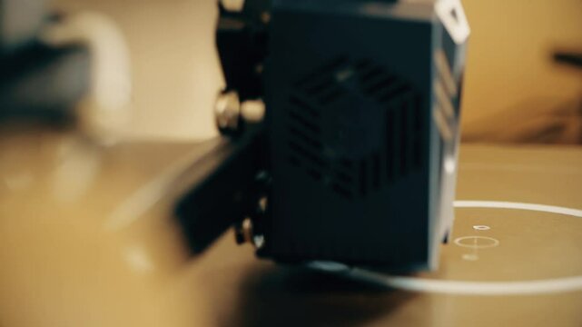 A filament 3d printer prints the model, close-up shot