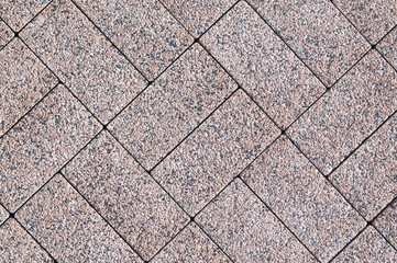 pink stone paving slabs close up