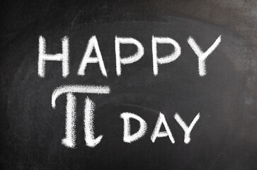 Happy Pi Day text on blackboard background, greeting  concept.