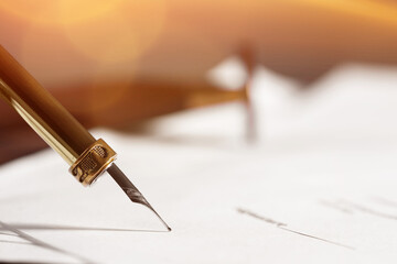 Signing notary document with fountain pen, closeup. Space for text
