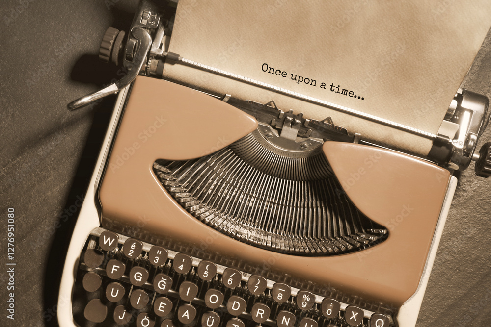 Fototapete typewriter with sheet of paper on table, top view. typed text once upon a time