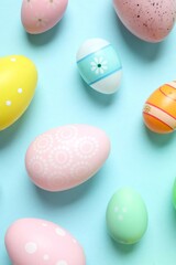 Happy Easter card. Easter eggs on color background, top view