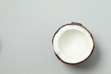 Coconut on gray background, top view