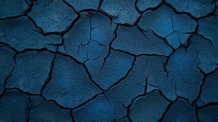 Obraz premium Intricate patterns on a deep blue cracked surface texture, captivating abstract background