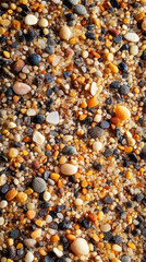 Close up of fine sand grains showcasing variety of individual colors and textures, creating beautiful natural pattern. intricate details highlight diversity found in nature