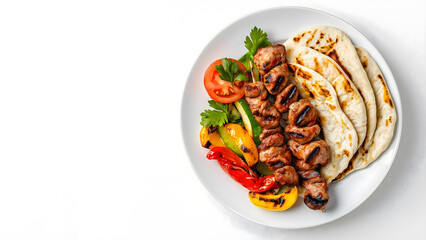 A high-resolution studio shot of Turkish Adana kebab served on a white plate, accompanied by grilled vegetables and flatbread. The dish is placed on the right side of the frame on a white background