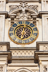 Clock (made in year 1288) on Westminster Abbey facade in London, UK