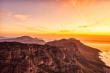 Cape Town Sunset Aerial View from Table Mountain over Camps Bay, Lion's Head and Twelve Apostles in the Background