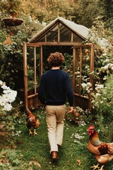 Man walks towards greenhouse surrounded by lush flowers and curi