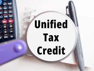 Unified Tax Credit text under magnification tax background