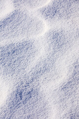 Obraz premium View of natural snow texture in winter in mountains.