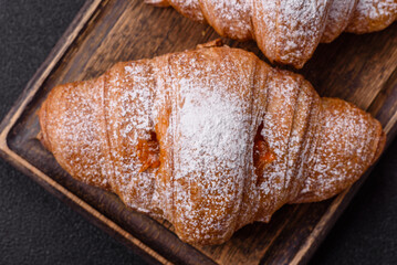 Sweet fresh crispy croissant with fruit filling