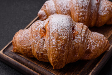 Sweet fresh crispy croissant with fruit filling