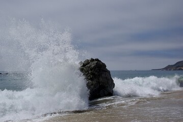 Crashing waves into rock
