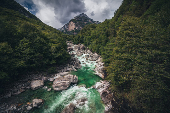 lake in the Valle Verzasca with blue turquoise water with long exposure frozen, long exposure taken with drone from air aerial