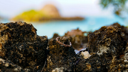 engagement ring on the rocks