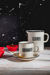 Coffee with Milk and Chocolate Muffins on Wooden Table