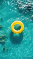 Obraz premium Yellow inflatable ring in the ocean outdoors nature underwater.