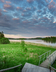 Beautiful view of a lake with a cloudy sky in the background