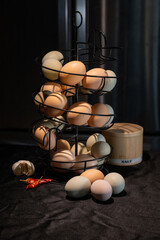 Chicken eggs in dark kitchen