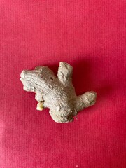 ginger root on red background