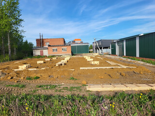 On a sunny bright day at an open construction site for foundation construction.
