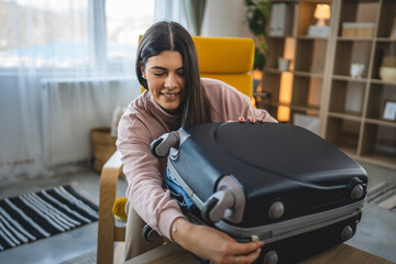 One woman pack suitcase baggage prepare for vacation holiday