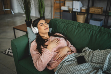 one woman doing guided meditation yoga self care practice at home