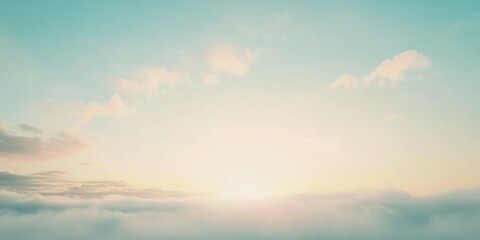 Fototapeta premium Gentle sunrise over a serene horizon with soft clouds in the early morning sky
