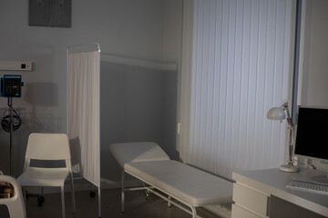 A serene and minimally designed medical examination room that promotes calmness and comfort