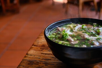 A bowl of North Vietnamese-style pho tai lan with beef cooked in tallow and garlic at VN Street...