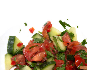 A chunky salsa salad of tomatoes and cucumber and herbs close up of salad vegetables