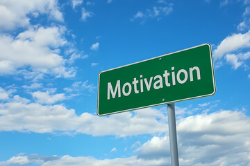 Motivational Sign against Sky: A vibrant green road sign bearing the word "Motivation" stands prominently against a clear blue sky dotted with fluffy white clouds.
