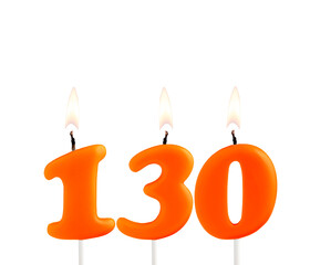 Lit birthday candle - Candle number 130 on white background.